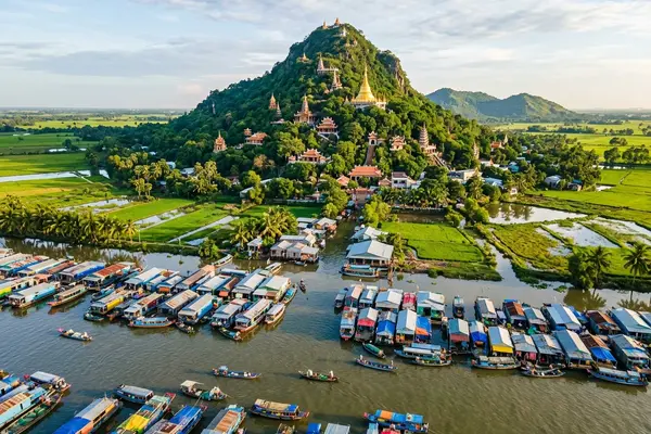 Chau Doc riverside with floating houses and Sam Mountain, Mekong Delta, Vietnam