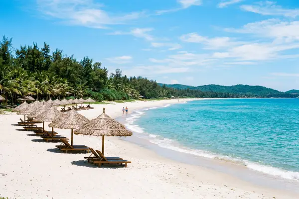 An Bang Beach with turquoise water and beach parasols