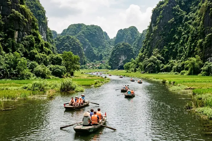 Traditional rowing boats at Tam Coc in Ninh Binh with limestone karsts