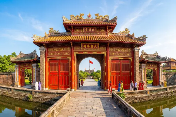 Hue Imperial Citadel ornate red and gold gates in morning sunlight