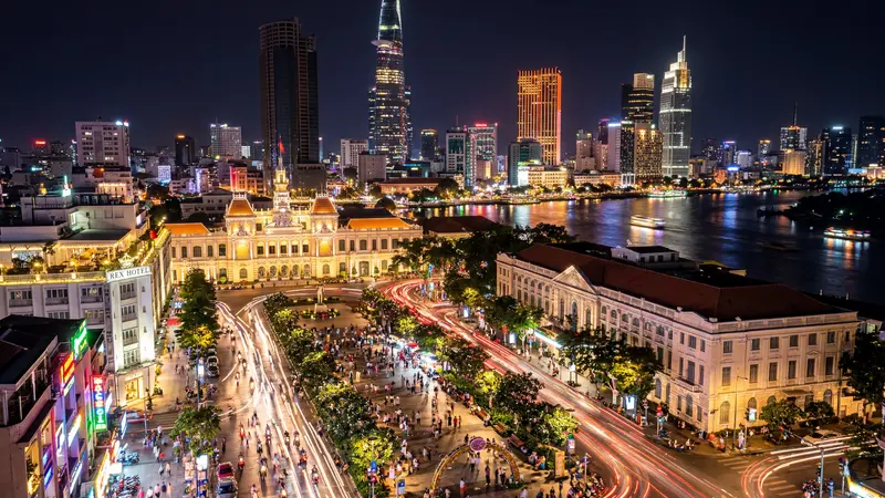 Ho Chi Minh City skyline at night with motorbike light trails