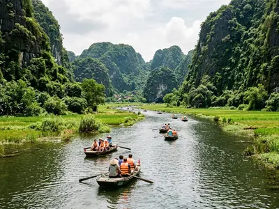 Traditional rowing boats at Tam Coc in Ninh Binh with limestone karsts