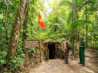 Cu Chi Tunnels entrance surrounded by tropical jungle