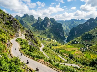 Ha Giang Loop mountain road winding through limestone peaks