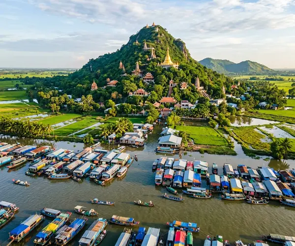 Chau Doc riverside with floating houses and Sam Mountain, Mekong Delta, Vietnam