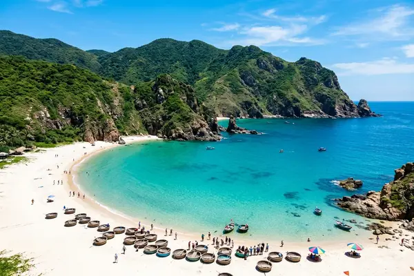 Qui Nhon crescent beach with Cham tower ruins on the coastline, Vietnam