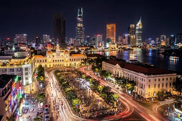 Ho Chi Minh City skyline at night with motorbike light trails